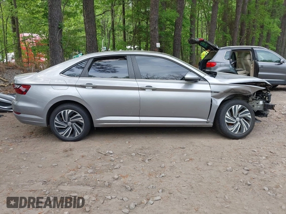 2020 Volkswagen Jetta SEL z VIN 3VWE57BU9LM082552, wystawiony jako IAAI lot #42091492 z przebiegiem 60 775 mil mil oraz . Historia ofert i sprzedaży dostępna na DreamBid. Obrazek 13.