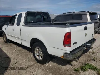 2003 Ford F-150 XL with VIN 1FTRX17L53NB90331, listed as a Copart auction lot 76686124 with 0 mi miles and Salvage Title. Bid and sale history available at carsss.com. Image 2.