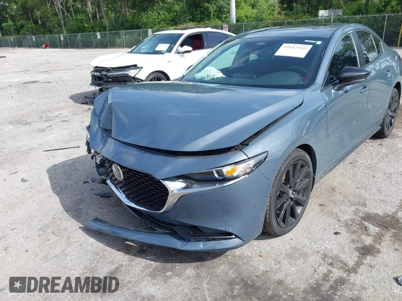 2024 Mazda 3 S Carbon Edition with VIN 3MZBPBCM2RM403824, listed as a IAAI auction lot 42612315 with 8,261 mi miles and . Bid and sale history available at DreamBid. Image 6.