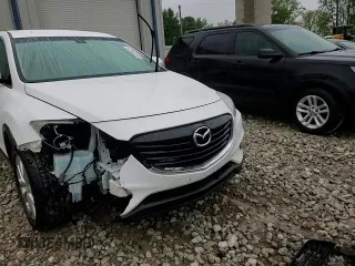 2013 Mazda CX-9 Grand Touring z VIN JM3TB3DV3D0412229, wystawiony jako Copart lot #57334325 z przebiegiem 146 976 mil mil oraz Czysty tytuł • Clean title. Historia ofert i sprzedaży dostępna na DreamBid. Obrazek 14.