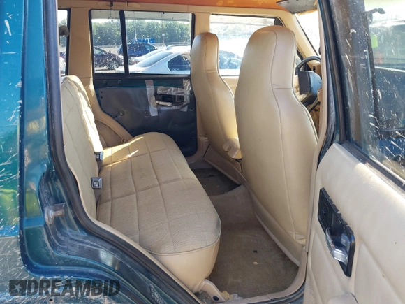 1995 Jeep Cherokee Sport z VIN 1J4FJ68S7SL623451, wystawiony jako IAAI lot #42581407 z przebiegiem 160 581 mil mil oraz . Historia ofert i sprzedaży dostępna na DreamBid. Obrazek 8.
