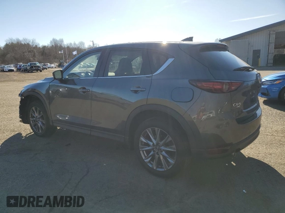 2021 Mazda CX-5 Grand Touring with VIN JM3KFBDM1M0489859, listed as a Copart auction lot 48688905 with 36,882 mi miles and Salvage Title. Bid and sale history available at DreamBid. Image 2.