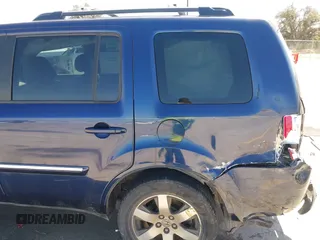 2013 Honda Pilot Touring with VIN 5FNYF3H94DB018384, listed as a IAAI auction lot 41672767 with 188,922 mi miles and . Bid and sale history available at DreamBid. Image 6.