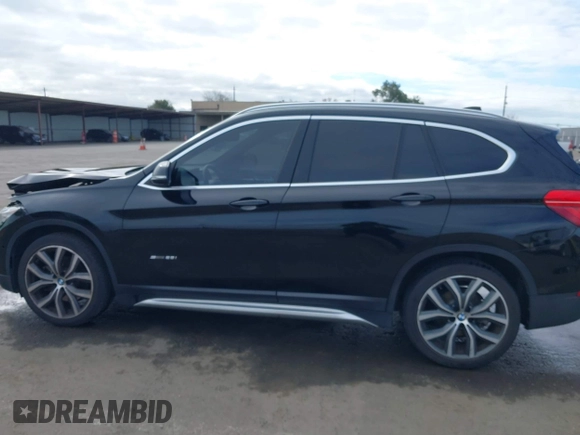 2017 BMW X1 sDrive28i with VIN WBXHU7C3XHP924635, listed as a IAAI auction lot 41744824 with 74,143 mi miles. Bid and sale history available at carsss.com. Image 14.