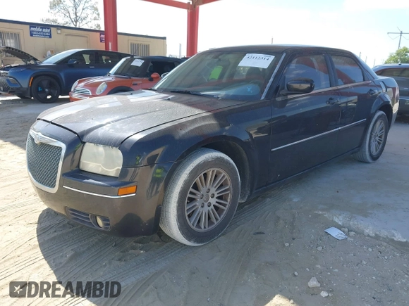 2009 Chrysler 300 Touring with VIN 2C3KA53V59H621936, listed as a IAAI auction lot 42112314 with 198,461 mi miles. Bid and sale history available at carsss.com. Image 2.