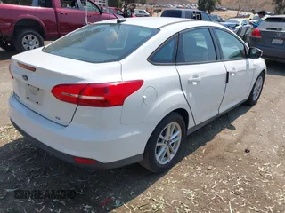 2016 Ford Focus SE z VIN 1FADP3F24GL268619, wystawiony jako IAAI lot #42750298 z przebiegiem 96 587 mil mil oraz . Historia ofert i sprzedaży dostępna na DreamBid. Obrazek 4.