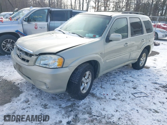 2006 Mazda Tribute LX with VIN 4F2YZ94126KM09467, listed as a IAAI auction lot 41324941 with 116,519 mi miles and . Bid and sale history available at DreamBid. Image 2.