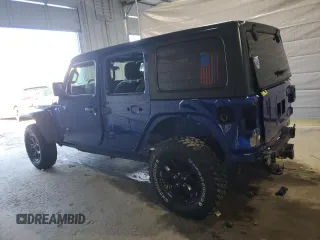 2020 Jeep Wrangler Unlimited Black and Tan with VIN 1C4HJXDG1LW267312, listed as a Copart auction lot 49658135 with 66,624 mi miles and Salvage title. Bid and sale history available at DreamBid. Image 2.