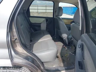 2005 Ford Escape Hybrid with VIN 1FMCU95H55KC07544, listed as a IAAI auction lot 42104756 with 250,109 mi miles. Bid and sale history available at carsss.com. Image 8.