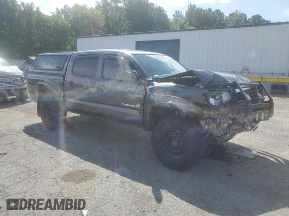 2014 Toyota Tacoma with VIN 3TMLU4EN2EM163797, listed as a Copart auction lot 61078805 with 130,748 mi miles and Salvage title. Bid and sale history available at DreamBid. Image 4.