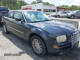 2009 Chrysler 300 Touring with VIN 2C3KA53V99H584082, listed as a IAAI auction lot 42026860 with 147,558 mi miles. Bid and sale history available at carsss.com. Image 1.