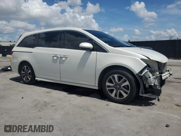 2017 Honda Odyssey Touring z VIN 5FNRL5H99HB007993, wystawiony jako Copart lot #60501805 z przebiegiem 104 628 mil mil oraz Szkoda całkowita • Salvage title. Historia ofert i sprzedaży dostępna na DreamBid. Obrazek 4.