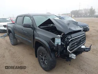 2021 Toyota Tacoma SR z VIN 3TYAX5GN0MT011893, wystawiony jako IAAI lot #41465871 z przebiegiem 57 830 mil mil oraz . Historia ofert i sprzedaży dostępna na DreamBid. Obrazek 1.