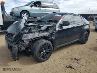 2011 BMW X6 M with VIN 5YMGZ0C54BLK13876, listed as a Copart auction lot 68567774 with 0 mi miles and Salvage Title. Bid and sale history available at carsss.com. Image 1.