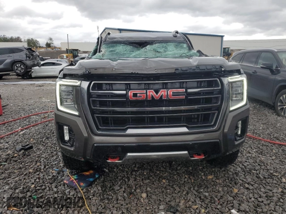 2021 GMC Yukon AT4 with VIN 1GKS2CKD8MR299277, listed as a Copart auction lot 47027565 with 54,806 mi miles and Salvage Title. Bid and sale history available at carsss.com. Image 5.
