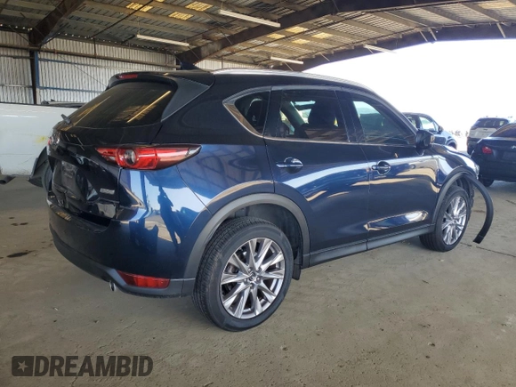 2019 Mazda CX-5 Grand Touring with VIN JM3KFADM3K1539890, listed as a Copart auction lot 57809835 with 56,079 mi miles and Salvage title. Bid and sale history available at DreamBid. Image 3.