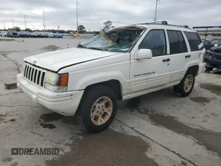 1997 Jeep Grand Cherokee Limited with VIN 1J4GX78YXVC716353, listed as a Copart auction lot 85207974 with 115,527 mi miles and Salvage Title. Bid and sale history available at carsss.com. Image 1.