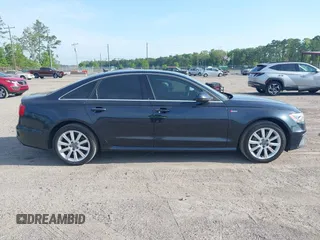 2015 Audi A6 3.0T Prestige with VIN WAUHGAFC3FN011654, listed as a IAAI auction lot 42104153 with 166,719 mi miles. Bid and sale history available at carsss.com. Image 13.