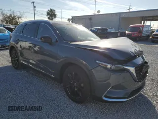 2021 Mazda CX-9 Grand Touring with VIN JM3TCADY1M0517525, listed as a Copart auction lot 43868965 with 123,602 mi miles and Salvage title. Bid and sale history available at DreamBid. Image 4.