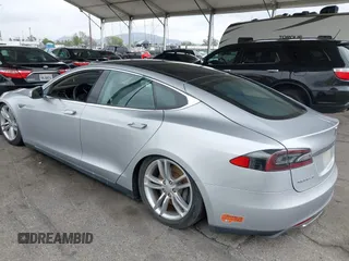 2014 Tesla Model S 60 with VIN 5YJSA1H12EFP32213, listed as a IAAI auction lot 42194085 with 56,071 mi miles and . Bid and sale history available at DreamBid. Image 3.