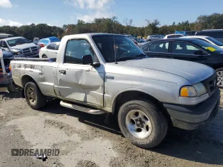 2003 Mazda B-Series 2WD Truck SX with VIN 4F4YR12DX3TM03461, listed as a Copart auction lot 87044124 with 214,552 mi miles and Clean Title. Bid and sale history available at carsss.com. Image 4.