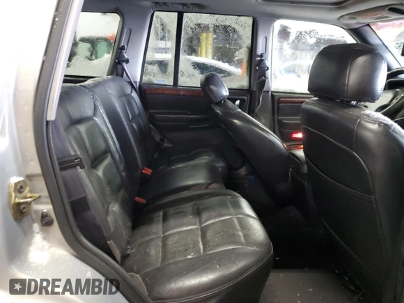 1997 Jeep Grand Cherokee Limited with VIN 1J4GZ78Y1VC706353, listed as a Copart auction lot 41437085 with 163,675 mi miles and Salvage Title. Bid and sale history available at carsss.com. Image 11.