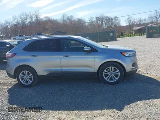 2020 Ford Edge SEL z VIN 2FMPK4J93LBB01318, wystawiony jako IAAI lot #42038334 z przebiegiem 73 435 mil mil oraz . Historia ofert i sprzedaży dostępna na DreamBid. Obrazek 13.