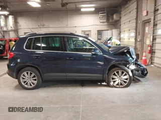 2011 Volkswagen Tiguan SE with VIN WVGBV7AXXBW533872, listed as a IAAI auction lot 40197835 with 104,685 mi miles and . Bid and sale history available at DreamBid. Image 13.