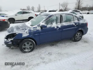 2006 Hyundai Accent GL z VIN KMHCN45C26U055801, wystawiony jako Copart lot #43410575 z przebiegiem 123 448 mil mil oraz Szkoda całkowita • Salvage title. Historia ofert i sprzedaży dostępna na DreamBid. Obrazek 1.