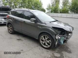2015 Ford Escape Titanium with VIN 1FMCU9J93FUA67563, listed as a Copart auction lot 61770085 with 134,201 mi miles and Salvage title. Bid and sale history available at DreamBid. Image 4.
