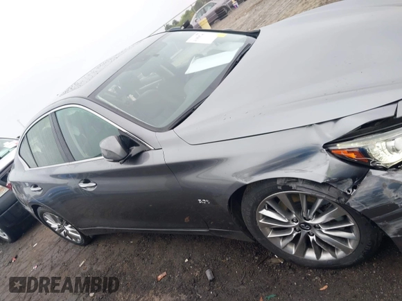 2019 Infiniti Q50 Luxe z VIN JN1EV7AP5KM518681, wystawiony jako IAAI lot #41958746 z przebiegiem 66 629 mil mil oraz . Historia ofert i sprzedaży dostępna na DreamBid. Obrazek 13.