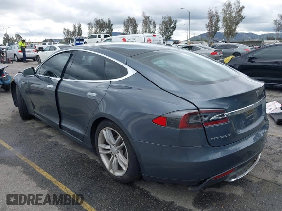 2013 Tesla Model S with VIN 5YJSA1CN8DFP21869, listed as a IAAI auction lot 41772603 with Not provided miles and . Bid and sale history available at DreamBid. Image 3.