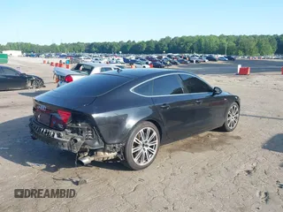 2014 Audi A7 Premium Plus z VIN WAUWGAFC4EN092525, wystawiony jako IAAI lot #42331183 z przebiegiem 183 258 mil mil oraz . Historia ofert i sprzedaży dostępna na DreamBid. Obrazek 4.
