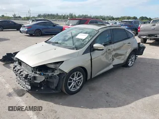 2015 Ford Focus SE with VIN 1FADP3F29FL292655, listed as a IAAI auction lot 41090945 with 106,060 mi miles. Bid and sale history available at carsss.com. Image 2.