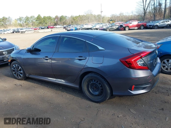 2017 Honda Civic Sedan LX with VIN 19XFC2F56HE233741, listed as a IAAI auction lot 42022068 with 65,587 mi miles. Bid and sale history available at carsss.com. Image 14.