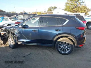 2021 Mazda CX-5 Grand Touring Reserve with VIN JM3KFBAYXM0465762, listed as a IAAI auction lot 40728368 with 30,667 mi miles. Bid and sale history available at carsss.com. Image 14.