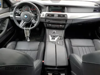 2014 BMW M5 z VIN WBSFV9C5XED097563, wystawiony jako Copart lot #72175354 z przebiegiem 73 406 mil mil oraz Szkody całkowita. Historia ofert i sprzedaży dostępna na DreamBid. Obrazek 8.