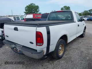 1999 Ford F-150 with VIN 1FTRF17W4XNC25668, listed as a IAAI auction lot 42731954 with 189,437 mi miles and . Bid and sale history available at DreamBid. Image 4.