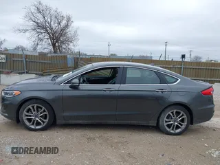 2019 Ford Fusion SEL with VIN 3FA6P0CDXKR129411, listed as a IAAI auction lot 42082323 with 126,048 mi miles and . Bid and sale history available at DreamBid. Image 14.