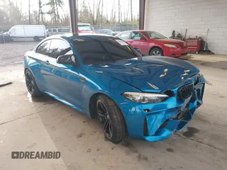 2018 BMW M2 with VIN WBS1J5C59JVA12718, listed as a IAAI auction lot 41796602 with 53,707 mi miles. Bid and sale history available at carsss.com. Image 1.