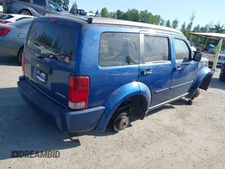 2010 Dodge Nitro SE with VIN 1D4PT2GK4AW141616, listed as a IAAI auction lot 42183953 with 128,023 mi miles. Bid and sale history available at carsss.com. Image 4.