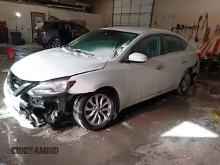 2019 Nissan Sentra S z VIN 3N1AB7AP9KY325065, wystawiony jako IAAI lot #41612204 z przebiegiem 141 818 mil mil oraz . Historia ofert i sprzedaży dostępna na DreamBid. Obrazek 17.