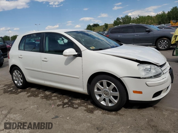 2009 Volkswagen Rabbit S with VIN WVWDB71K79W085935, listed as a Copart auction lot 60697594 with 102,780 mi miles and Salvage title. Bid and sale history available at DreamBid. Image 4.