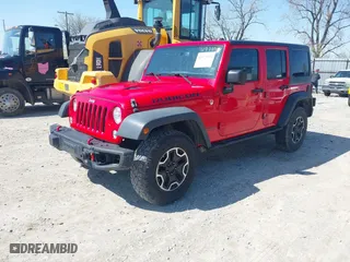 2015 Jeep Wrangler Unlimited Rubicon Hard Rock with VIN 1C4HJWFG9FL525556, listed as a IAAI auction lot 41973576 with 246,949 mi miles. Bid and sale history available at carsss.com. Image 17.