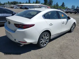 2021 Mazda 3 with VIN JM1BPBDL6M1340029, listed as a IAAI auction lot 42461850 with 79,798 mi miles and . Bid and sale history available at DreamBid. Image 4.