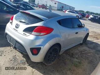 2013 Hyundai Veloster Turbo with VIN KMHTC6AE5DU112756, listed as a IAAI auction lot 42854505 with 99,015 mi miles and . Bid and sale history available at DreamBid. Image 4.