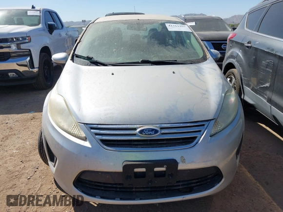 2013 Ford Fiesta SE z VIN 3FADP4BJ7DM165174, wystawiony jako IAAI lot #42311167 z przebiegiem 90 592 mil mil oraz . Historia ofert i sprzedaży dostępna na DreamBid. Obrazek 6.