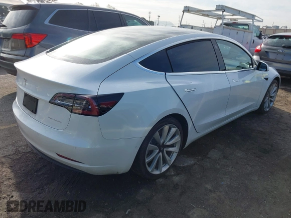 2020 Tesla Model 3 Long Range with VIN 5YJ3E1EB9LF620771, listed as a IAAI auction lot 41795008 with 53,155 mi miles and . Bid and sale history available at DreamBid. Image 4.