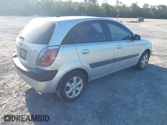 2009 Kia Rio LX with VIN KNADE243096440150, listed as a IAAI auction lot 42152589 with 114,484 mi miles. Bid and sale history available at carsss.com. Image 4.