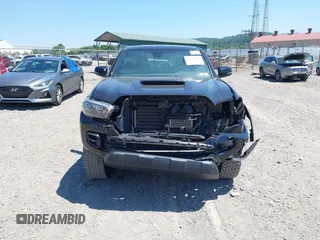 2019 Toyota Tacoma SR with VIN 5TFCZ5AN4KX208354, listed as a IAAI auction lot 42771410 with 77,509 mi miles and . Bid and sale history available at DreamBid. Image 13.